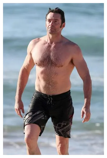 Hunky hugh! jackman shows off rock hard abs