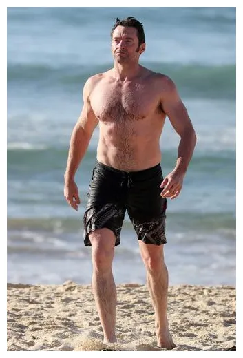 Hunky hugh! jackman shows off rock hard abs