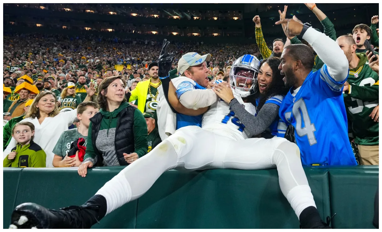 Watch lions st. brown blowing kiss at packer fan flipping him off