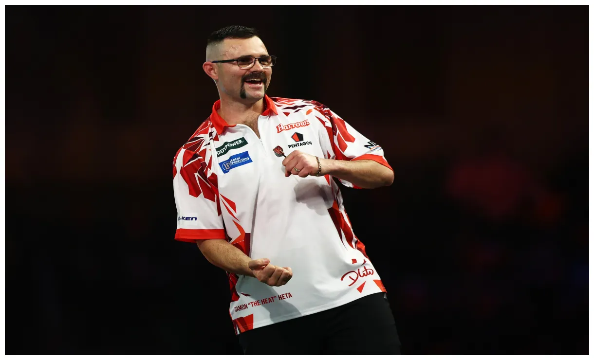 Lands nine-darter before shock defeat at world darts