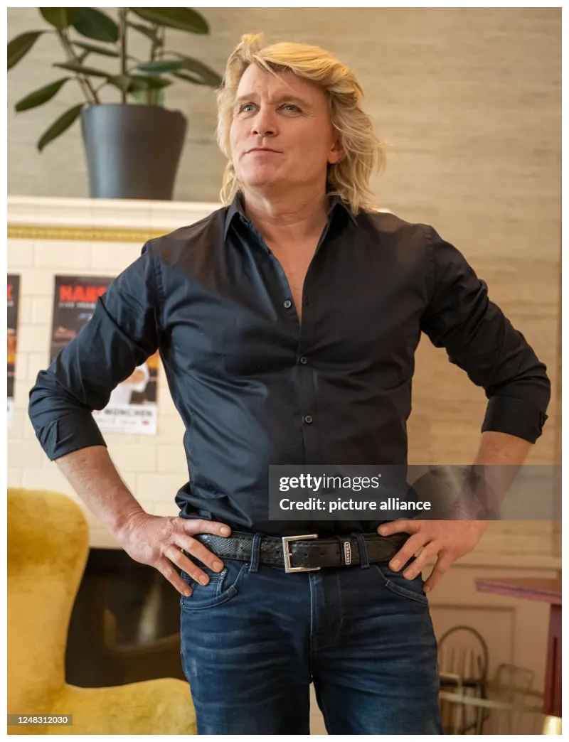 Magician poses for the press during the announcement for