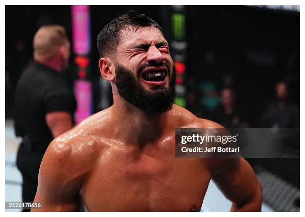 Ibo Aslan of Turkey reacts after absorbing a low blow from Anton