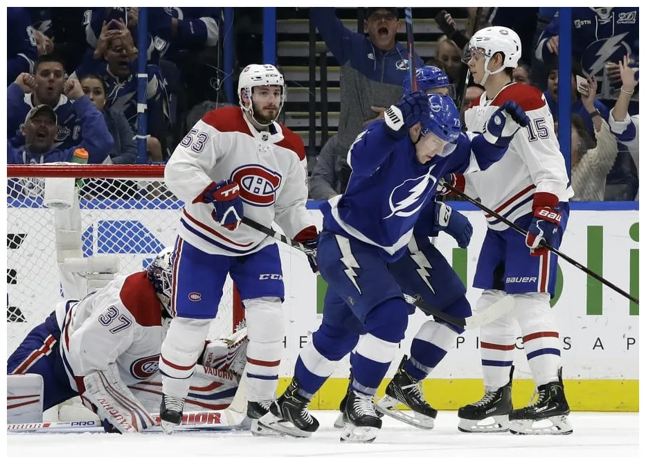 Tampa bay lightning beat montreal canadiens on adam erne's late tally