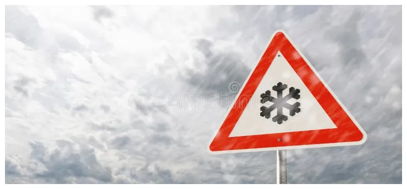 Warning sign caution snow fall or first snow, winter driving risk of