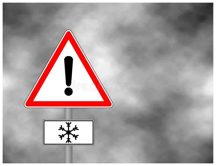 Winter warning sign shows danger of ice and snow at street, highway or