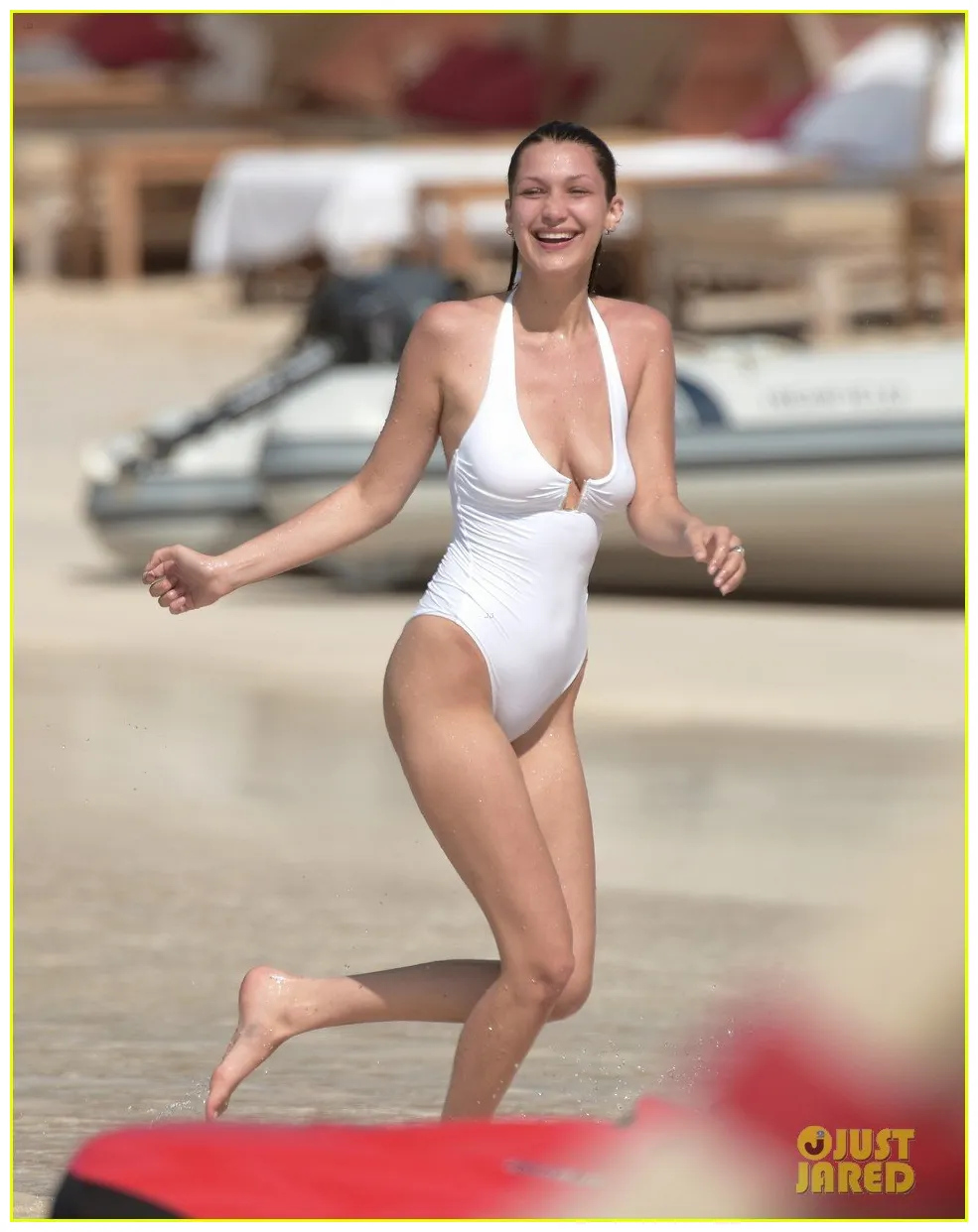 Bella hadid gets thrown into the caribbean seas during vacation